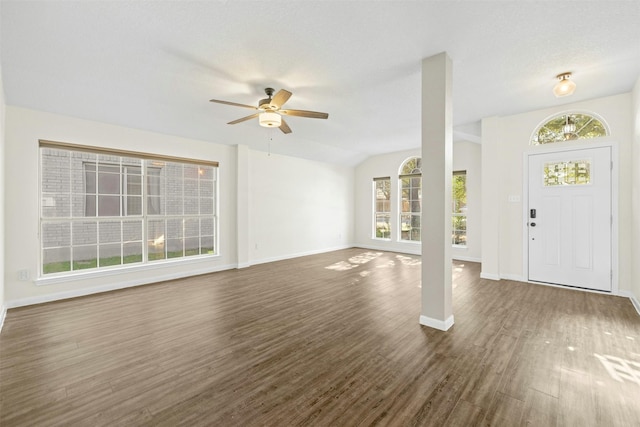 entrance foyer with ceiling fan, dark hardwood / wood-style flooring, a healthy amount of sunlight, and lofted ceiling