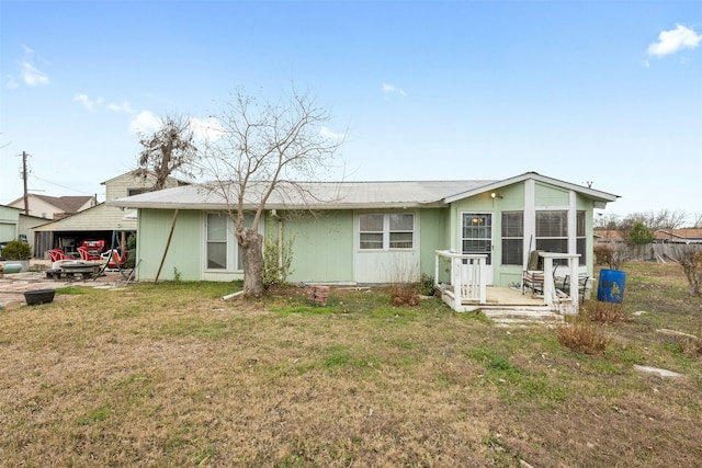 back of house with a yard