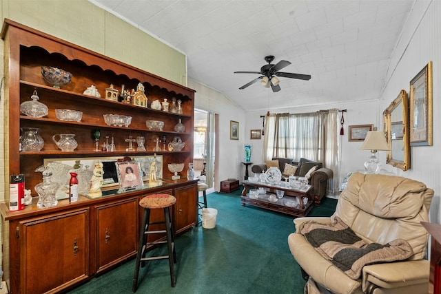 interior space featuring ceiling fan, brick wall, and dark carpet