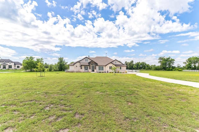 single story home featuring a front yard