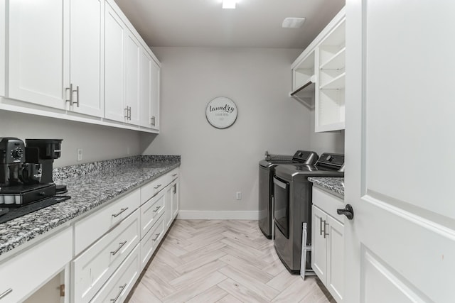 washroom with light parquet flooring and independent washer and dryer