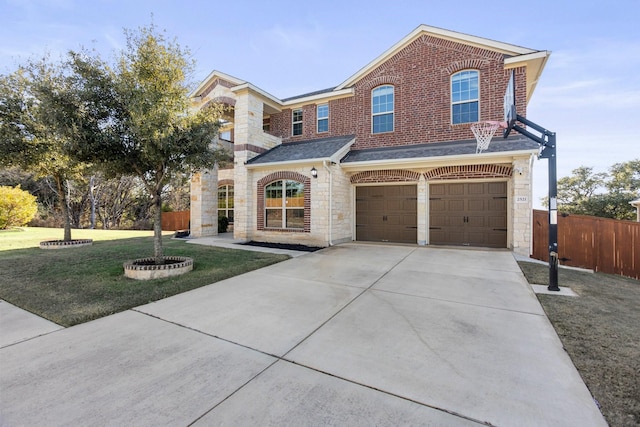 view of front of house with a front yard and a garage