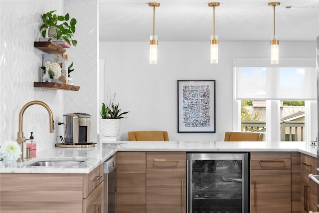 bar with sink, beverage cooler, decorative light fixtures, and stainless steel dishwasher