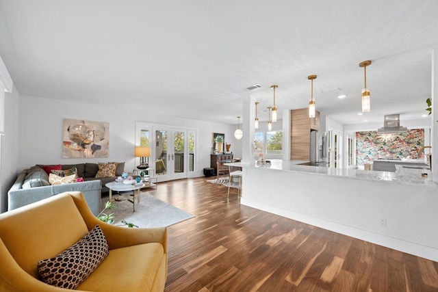 living room featuring french doors and hardwood / wood-style floors