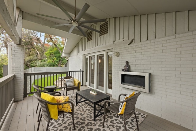 wooden deck with ceiling fan