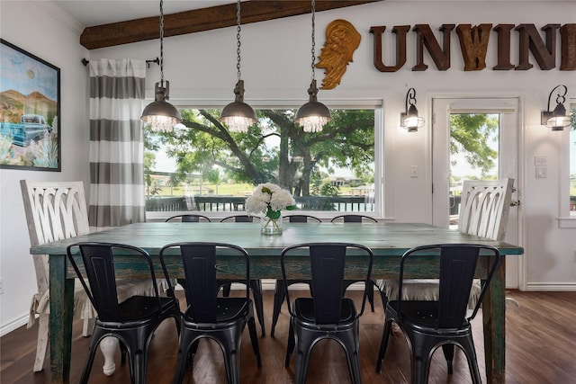 dining room with dark hardwood / wood-style flooring and lofted ceiling with beams