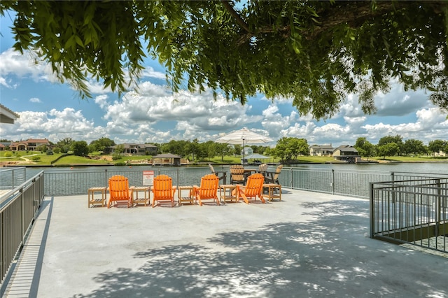 view of patio with a water view