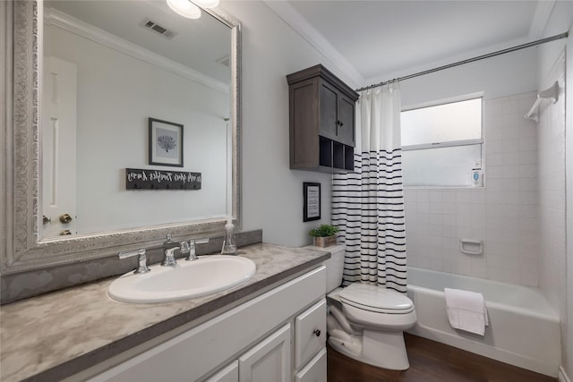 full bathroom featuring shower / tub combo, hardwood / wood-style floors, toilet, crown molding, and vanity