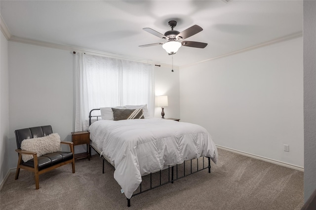 bedroom with carpet floors, ceiling fan, and crown molding