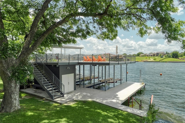 view of dock featuring a water view and a lawn