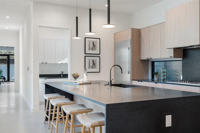 2512 Ridgeview St, Austin, TX 78704 - kitchen with modern cabinets, built in refrigerator, a kitchen breakfast bar, ventilation hood, and gas stovetop