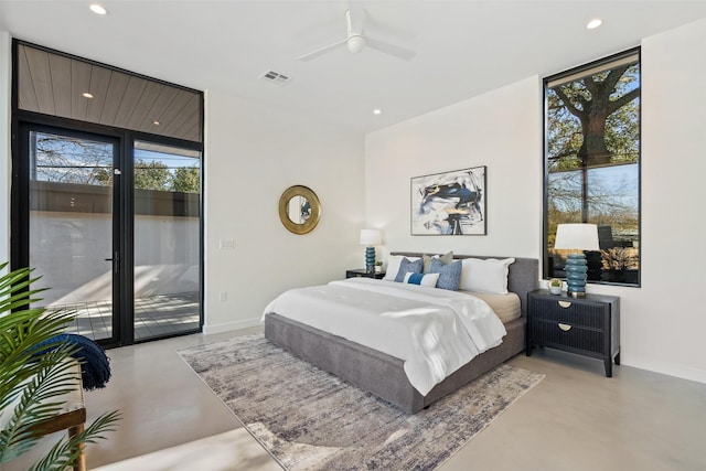 bedroom with ceiling fan, access to outside, and floor to ceiling windows