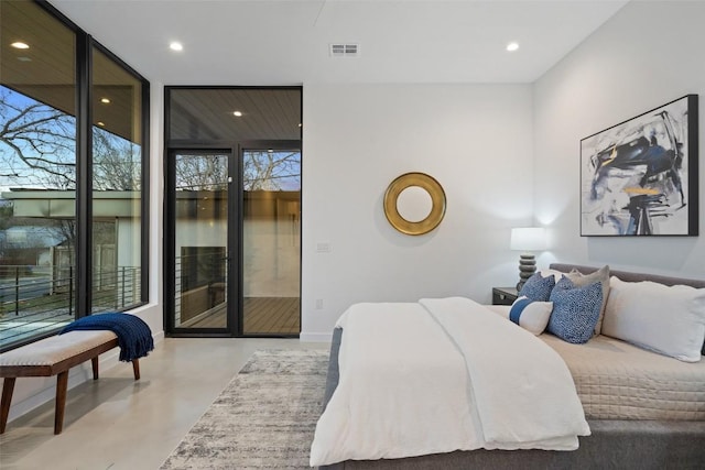 2512 Ridgeview St, Austin, TX 78704 - bedroom featuring concrete floors, access to outside, recessed lighting, and a wall of windows