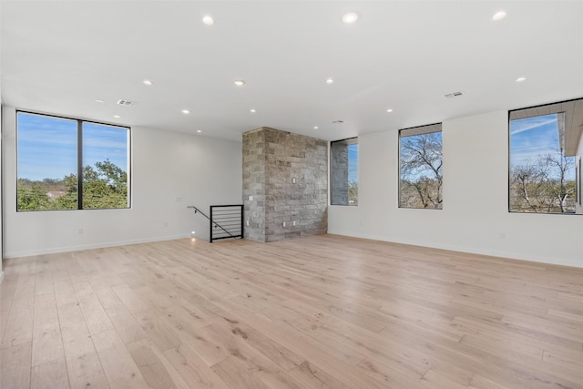 unfurnished living room with light hardwood / wood-style floors