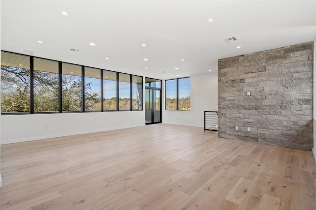 unfurnished room with light wood-type flooring