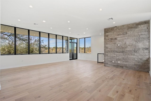 2512 Ridgeview St, Austin, TX 78704 - unfurnished living room featuring recessed lighting and light wood-style flooring