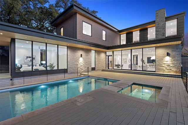 view of pool featuring a patio area and an outdoor hot tub