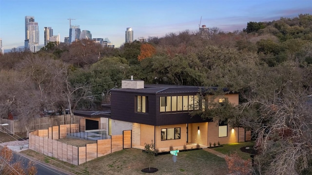 2512 Ridgeview St, Austin, TX 78704 - rear view of house with a chimney and a garage