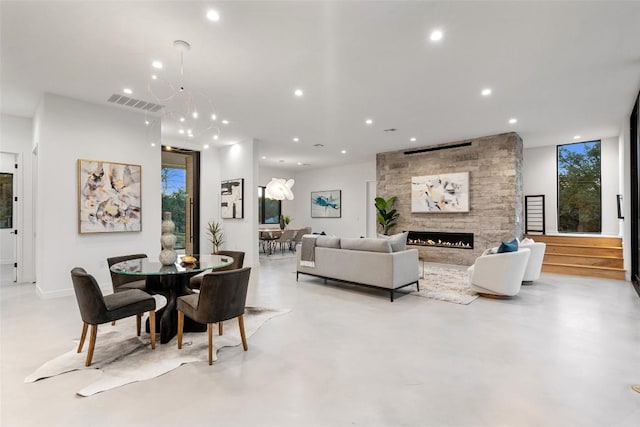 2512 Ridgeview St, Austin, TX 78704 - living area featuring recessed lighting, a fireplace, and concrete flooring