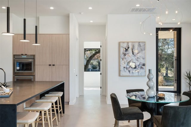 2512 Ridgeview St, Austin, TX 78704 - dining space featuring healthy amount of natural light, finished concrete flooring, and recessed lighting