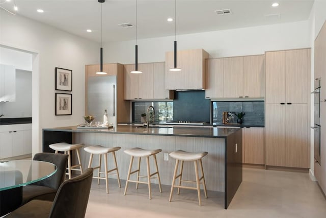 2512 Ridgeview St, Austin, TX 78704 - kitchen featuring modern cabinets, tasteful backsplash, dark countertops, and recessed lighting