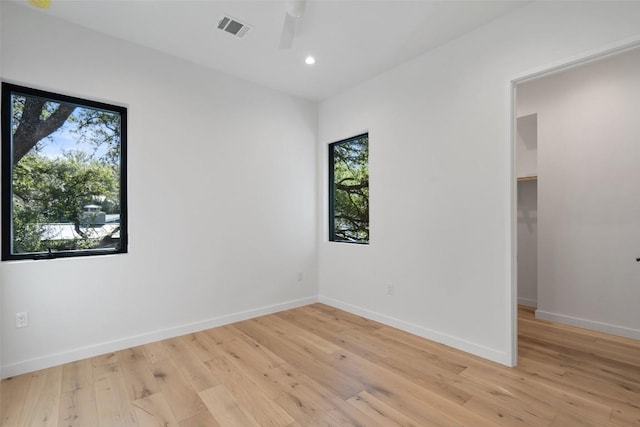 2512 Ridgeview St, Austin, TX 78704 - unfurnished bedroom with light wood finished floors, recessed lighting, and a ceiling fan
