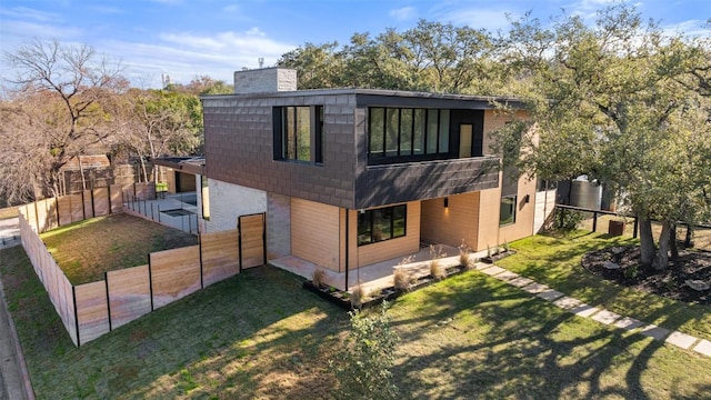 2512 Ridgeview St, Austin, TX 78704 - back of house featuring a chimney and a fenced backyard