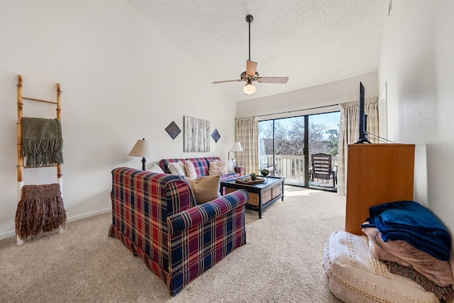 carpeted living room featuring ceiling fan, high vaulted ceiling, and a textured ceiling