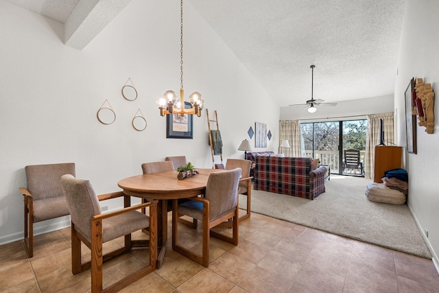 dining space featuring ceiling fan with notable chandelier, a towering ceiling, a textured ceiling, and light carpet