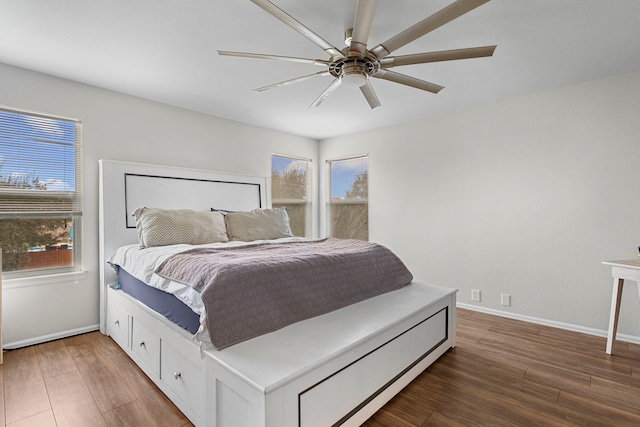 bedroom featuring ceiling fan and dark wood-type flooring