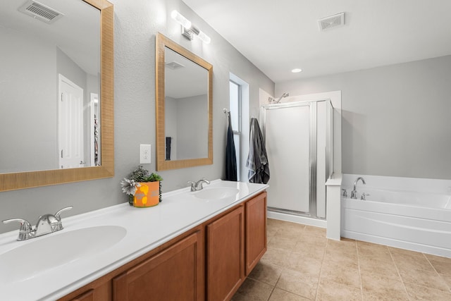 bathroom with vanity, tile patterned flooring, and shower with separate bathtub