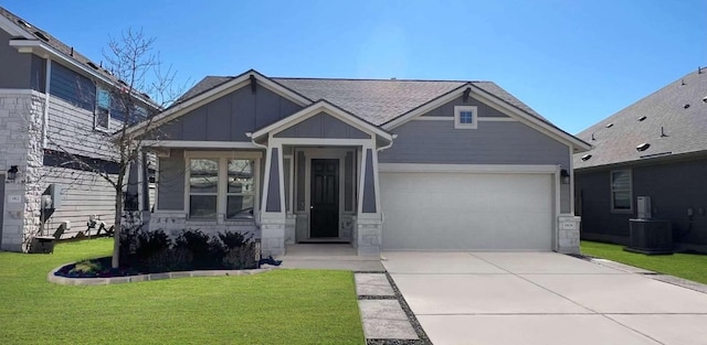 craftsman-style home with central AC unit and a front yard