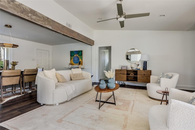 living room featuring ceiling fan and hardwood / wood-style floors