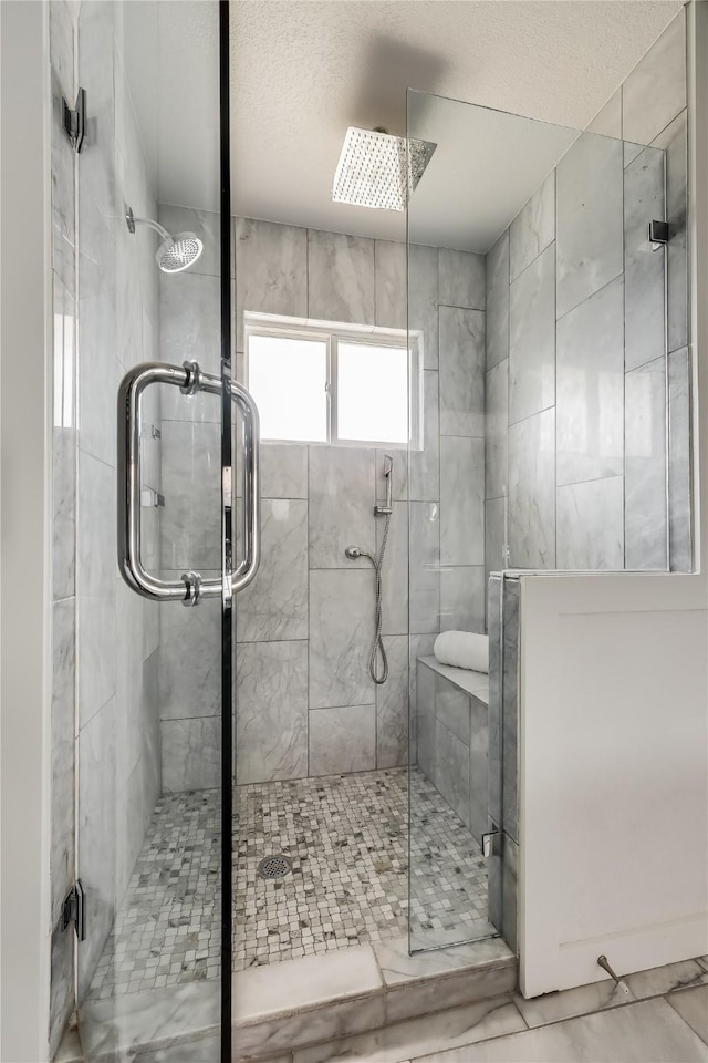 bathroom featuring a shower with door and tile patterned flooring