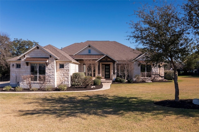 craftsman-style home featuring a front yard