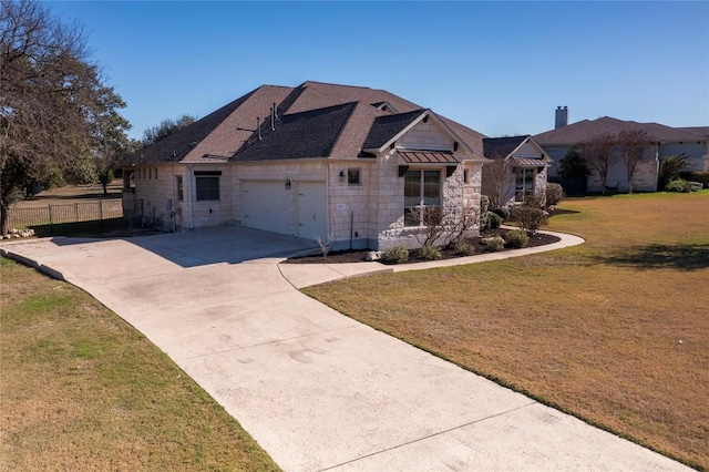 312 Brave Face St, Leander, TX 78641 - view of front of property with an attached garage, stone siding, and driveway