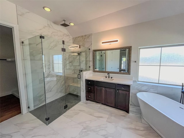 312 Brave Face St, Leander, TX 78641 - full bath with vaulted ceiling, a soaking tub, a marble finish shower, vanity, and marble finish floors