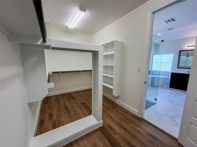 312 Brave Face St, Leander, TX 78641 - spacious closet with wood finished floors