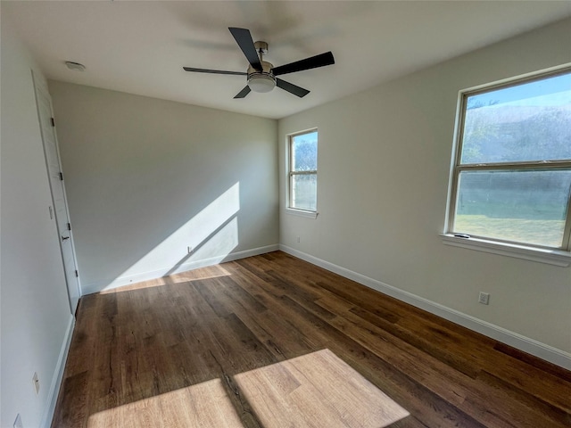 unfurnished room featuring ceiling fan and dark hardwood / wood-style flooring