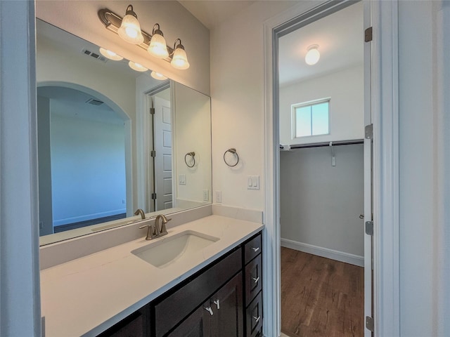 bathroom featuring hardwood / wood-style floors and vanity