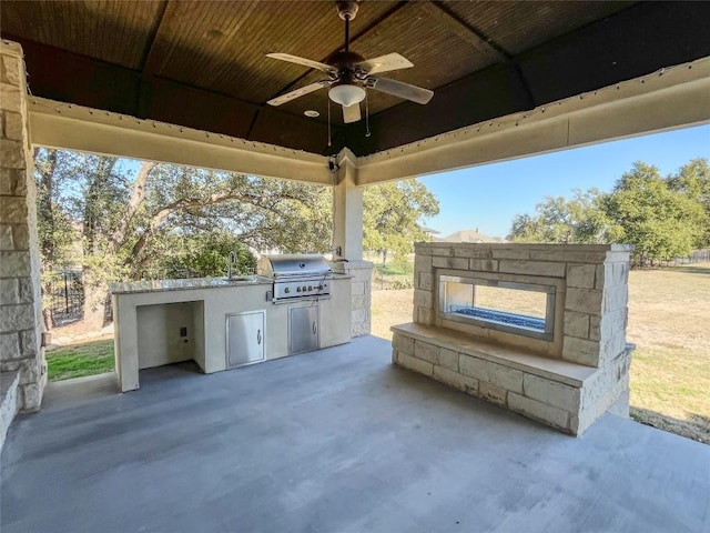 312 Brave Face St, Leander, TX 78641 - view of patio featuring exterior kitchen and a ceiling fan