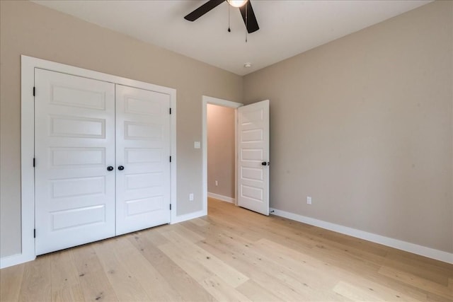 unfurnished bedroom with a closet, ceiling fan, and light hardwood / wood-style flooring