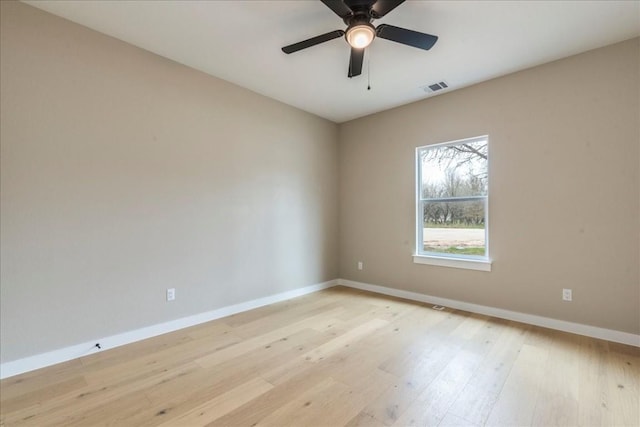 empty room with ceiling fan and light wood-type flooring