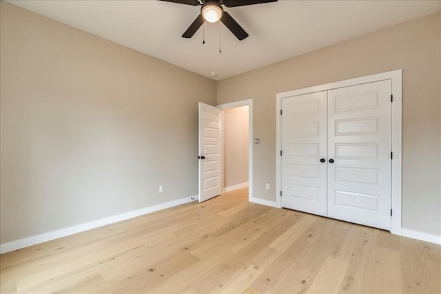 unfurnished bedroom featuring a closet, ceiling fan, and light wood-type flooring