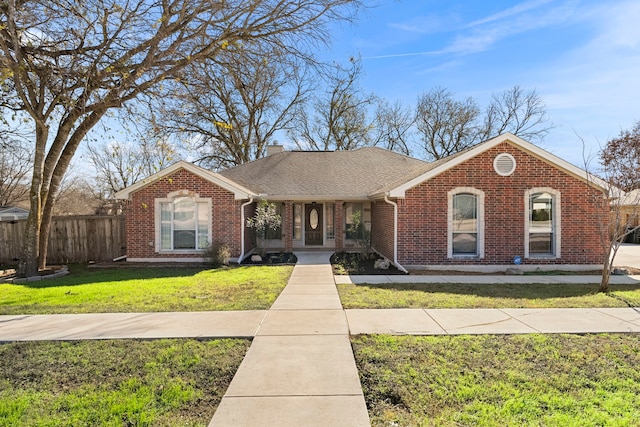 single story home featuring a front yard