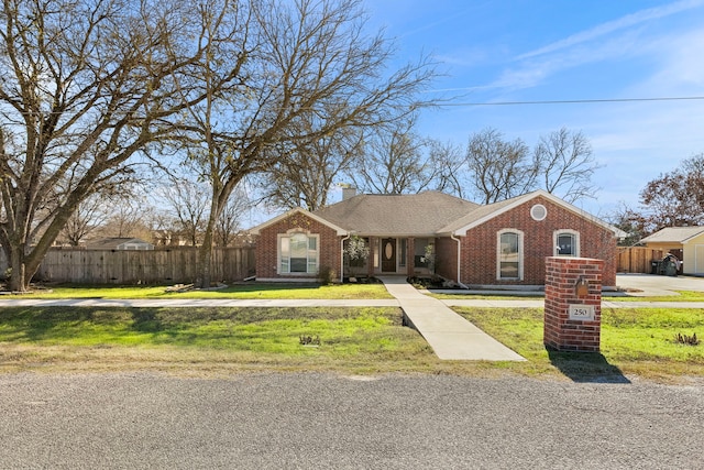 single story home featuring a front lawn