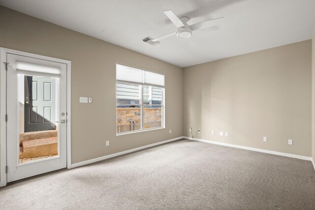 unfurnished room with ceiling fan and carpet floors