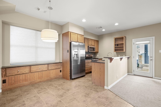 kitchen featuring a kitchen breakfast bar, light carpet, appliances with stainless steel finishes, a healthy amount of sunlight, and pendant lighting