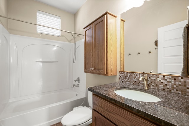 full bathroom with vanity,  shower combination, decorative backsplash, and toilet