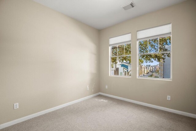 unfurnished room featuring carpet floors